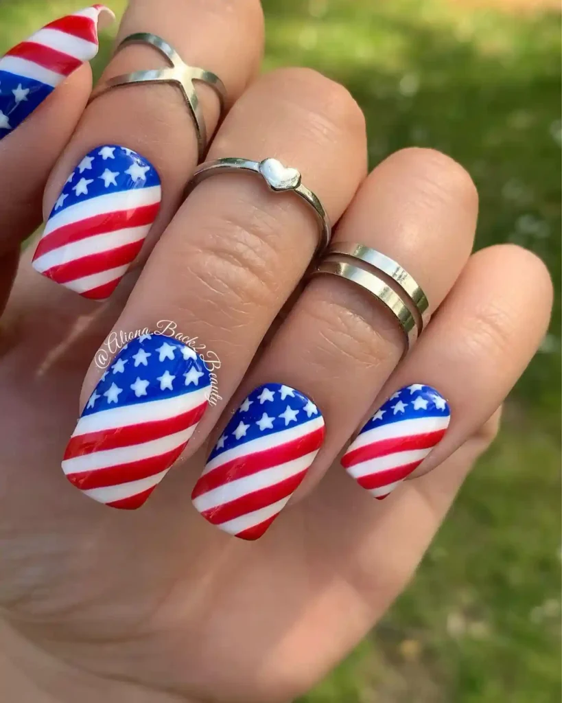 Fourth of July fake nails with the American flag design in red, blue, and white for a bold patriotic look