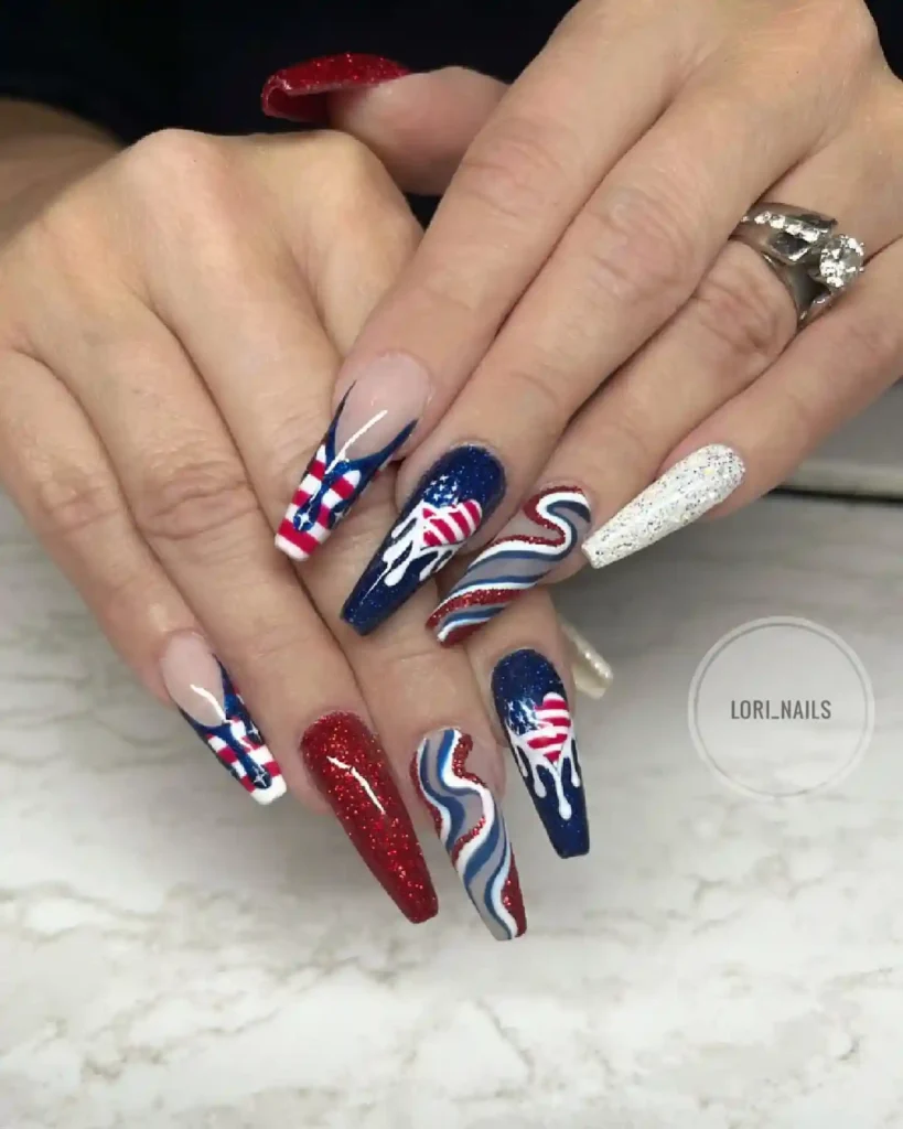 Glitter nail design in red, blue, and white with American flag heart, perfect for a festive 4th of July celebration