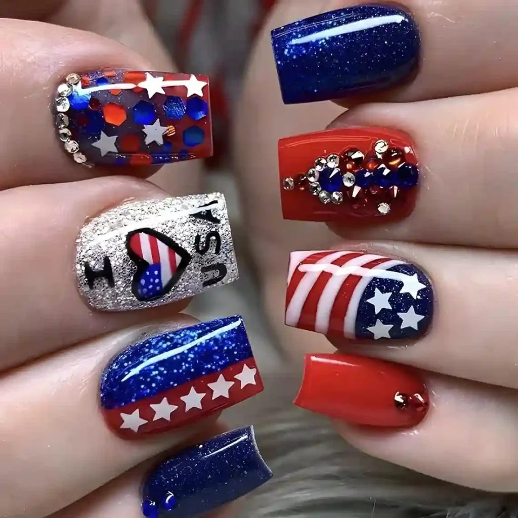 Patriotic nails with red, blue, and white glitter, featuring normal star stickers for a festive 4th of July look