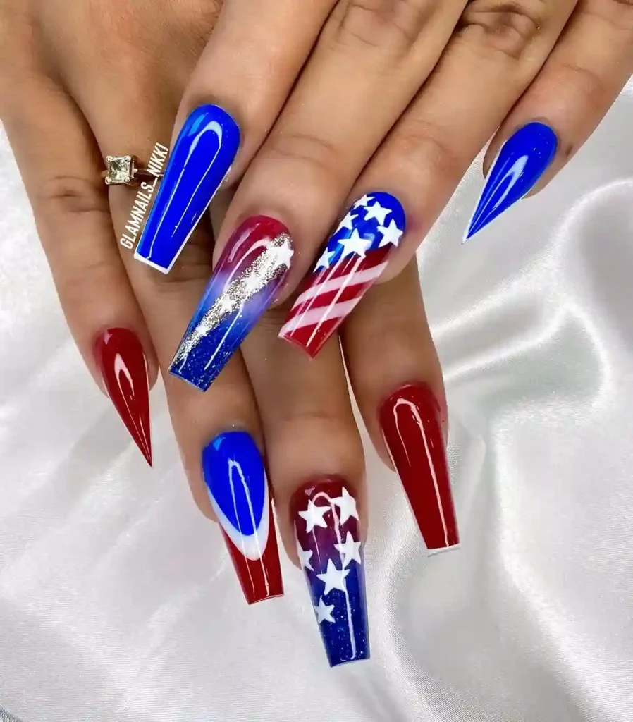 Red white and blue glitter nails with stars and stripes design, perfect for a sparkling patriotic 4th of July look