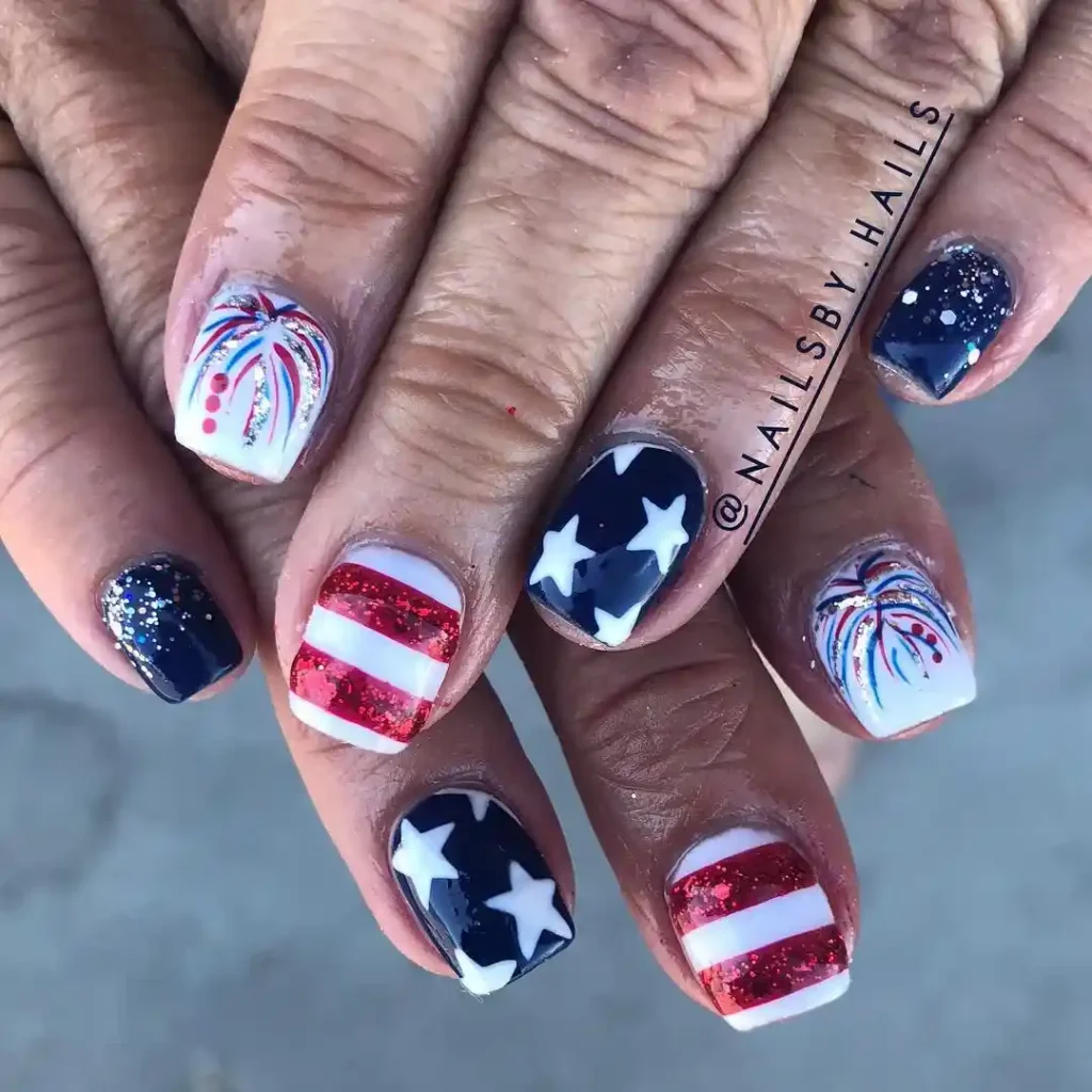 Simple gel nails in red, blue, and white with glitter, stars, and stripes design, perfect for a minimalist and festive look